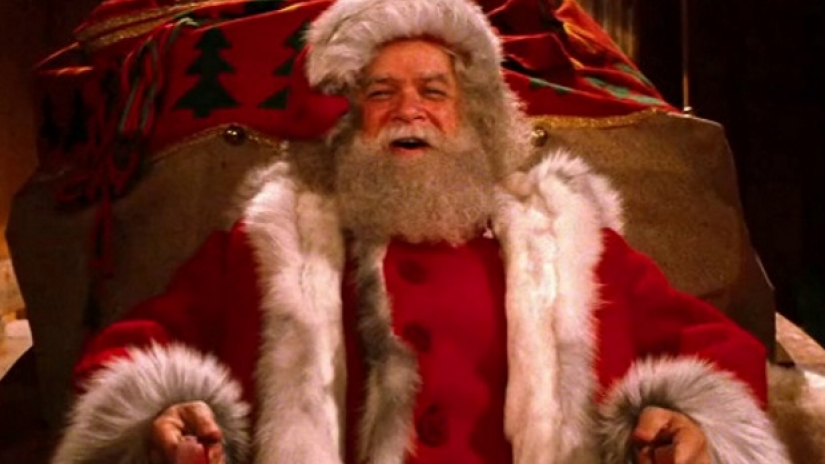 Santa and his reindeer flying over the city in Santa Claus: The Movie