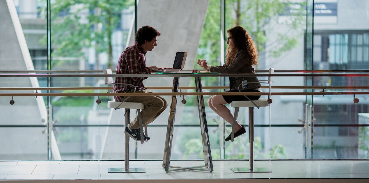 Promotional still from Netflix's The Altruists showing Julia Garner and Anthony Boyle as Caroline Ellison and Sam Bankman-Fried